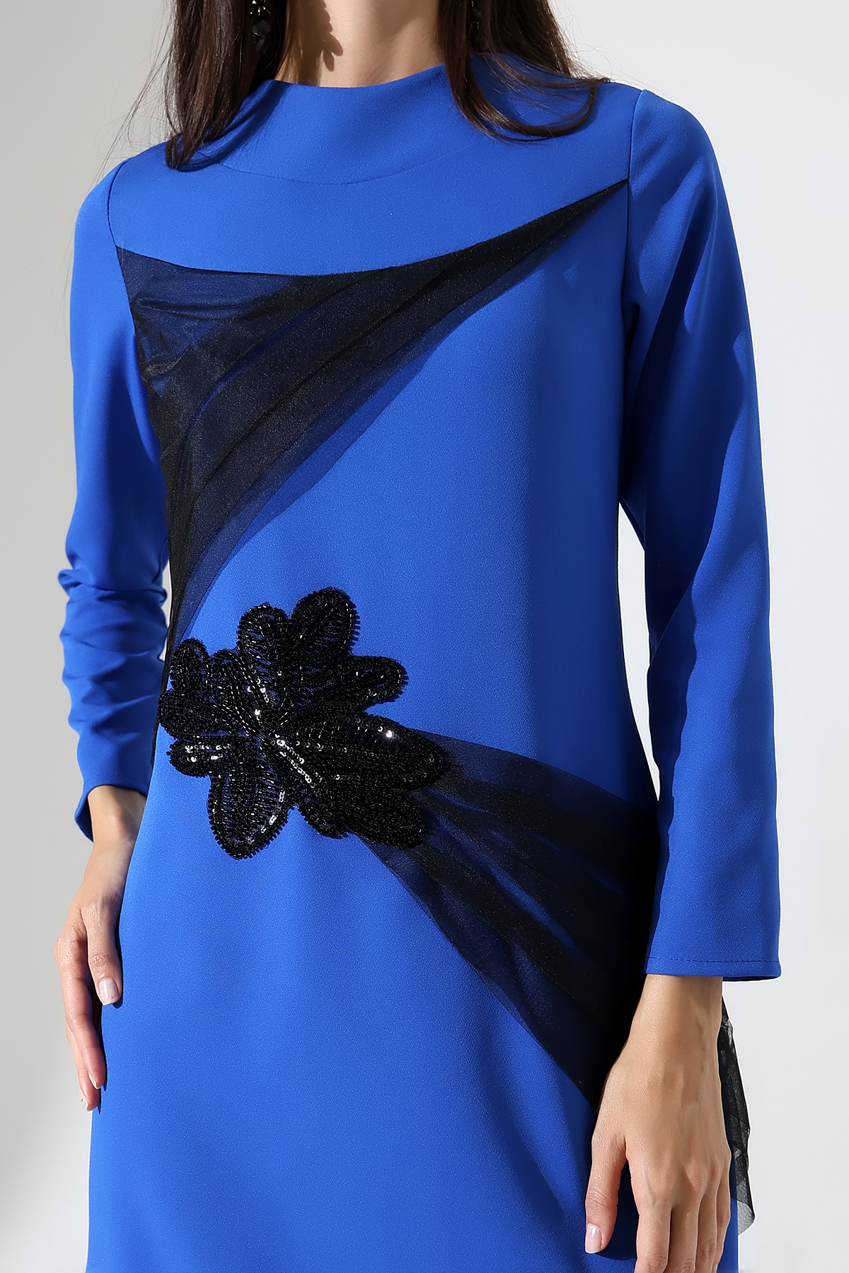 Close up of details on blue evening dress